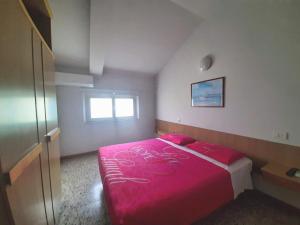 Posteľ alebo postele v izbe v ubytovaní Hotel Amalfi