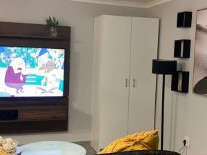 A television and/or entertainment centre at Short Term Rental Re-imagined