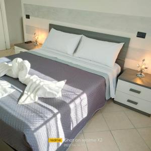 Una cama o camas en una habitación de Casa vacanze Darius