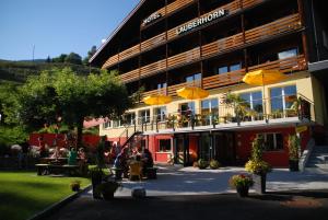 motorcycles are parked in front of a building at Hotel Lauberhorn - Home for Outdoor Activities in Grindelwald