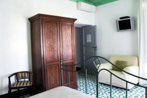 TV a/nebo společenská místnost v ubytování Residence Acanto
