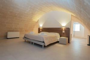 Postel nebo postele na pokoji v ubytování I Lamioni - Suite & accommodation