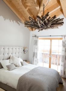 Postel nebo postele na pokoji v ubytování Central holiday flat Scalottas Lenzerheide