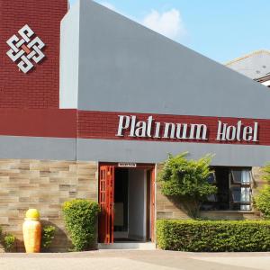 a building with a sign for a palimum hotel at Platinum Hotel in Gaborone