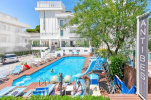 a swimming pool at a hotel with a resort at Hotel Antibes in Riccione