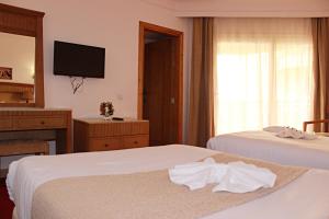 Gulta vai gultas numurā naktsmītnē Regency Pyramids Hotel