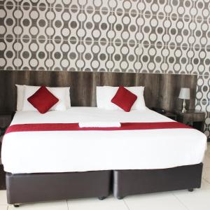 Łóżko lub łóżka w pokoju w obiekcie Platinum Hotel