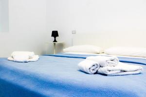 Postel nebo postele na pokoji v ubytování Residence Acanto