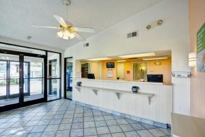 a lobby of a restaurant with a ceiling fan at Knights Inn Burlington NC in Burlington