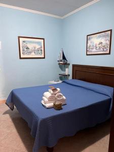 A bed or beds in a room at La Villa Del Patrizio
