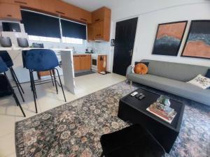 a living room with a couch and a table at Casa Di Penny 2 in Kyparissia