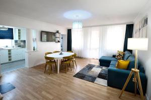 A kitchen or kitchenette at Best Apartman Lelle