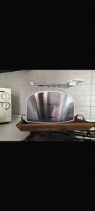 a stainless steel sink sitting on top of a counter at Bed and Breakfast da Nonna Ezia in Albenga