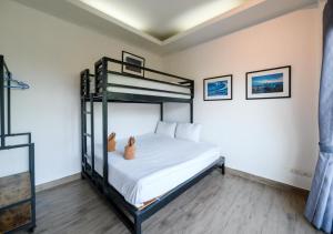 Postel nebo postele na pokoji v ubytování Room@Gallery Pool Villa