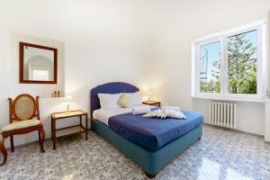 Postel nebo postele na pokoji v ubytování Villa Lo Pozzo, Anacapri
