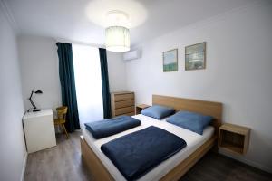 A bed or beds in a room at Best Apartman Lelle