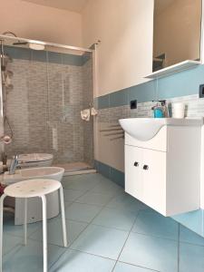 a bathroom with a sink and a toilet at Hello World in Agrigento +119 photos