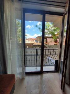 an open door to a balcony with a view at Morii Lake Apartment in Bucharest
