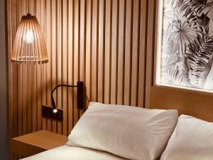 Postel nebo postele na pokoji v ubytování Hotel Noy