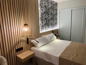 Postel nebo postele na pokoji v ubytování Hotel Noy