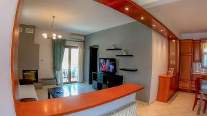 a living room with a counter top and a living room at ANTONY's LUXURY APARTMENTS in Nikiti