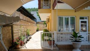 a balcony of a house with potted plants at Arda Apart Hotel in Kemer