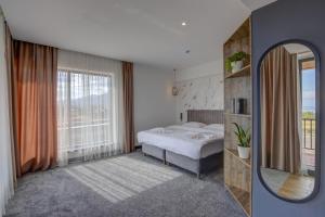 Olimp Hotel客房内的一张或多张床位