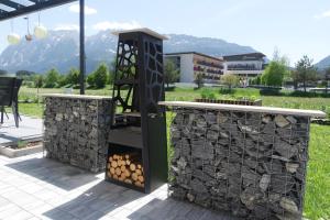 a fire station with a bunch of fire wood at Alpenlodge Bad Mitterndorf in Bad Mitterndorf