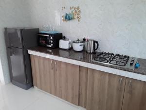 Kuchyň nebo kuchyňský kout v ubytování Blue Sky Self Catering