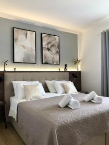 Postel nebo postele na pokoji v ubytování Corinne Garden Residence