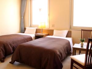 Postel nebo postele na pokoji v ubytování HOTEL LiVEMAX BUDGET Tokyo Kiba