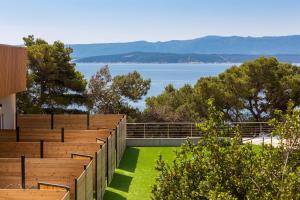 an outdoor amphitheater with a view of the water at Zlatni Rat Beach Resort in Bol