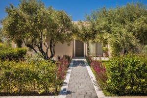 A garden outside Villa JOYANA