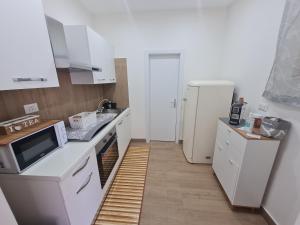 Nhà bếp/bếp nhỏ tại Sweet Home Airport