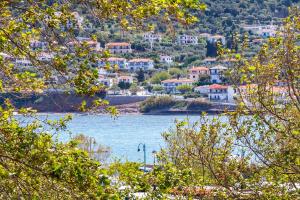 a view of a body of water with houses at Marialena Rooms in Skopelos Town