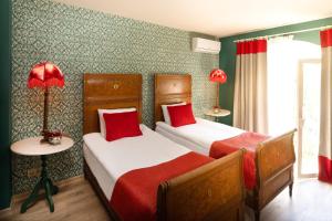 A bed or beds in a room at La Capria Suite Hotel Alacati