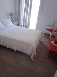 Postel nebo postele na pokoji v ubytování MELI-IOS