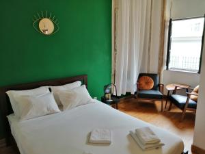 En eller flere senge i et værelse på Tilia Hostel