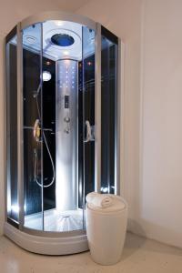 a shower stall with a toilet in a room at Business Hostel Wiesbaden ONE in Wiesbaden