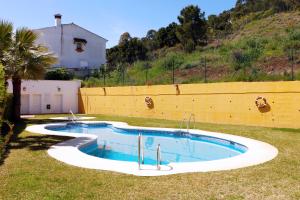 The swimming pool at or close to 3 Bedroom Townhouse Benahavis Village