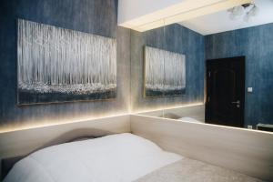 Llit o llits en una habitació de Urban Lux Apartmani