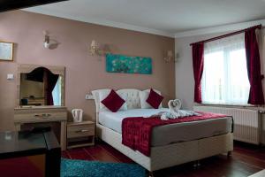 Postel nebo postele na pokoji v ubytování Ağva Carpediem Otel