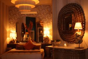 A bed or beds in a room at La Capria Suite Hotel Alacati