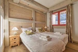 Posteľ alebo postele v izbe v ubytovaní La Blaitière - Luxe Apart Center Chamonix , Next to Piste Planard - By Cozee Rentals