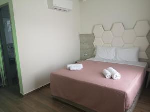 Posteľ alebo postele v izbe v ubytovaní Amalia Deluxe Villas + 37 fotografií