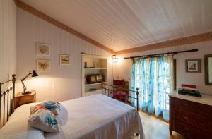 A bed or beds in a room at Agriturismo dalla Mimmi