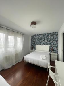 Posteľ alebo postele v izbe v ubytovaní Hostal Portofino