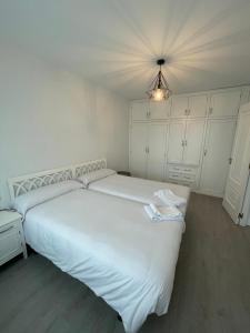 Posteľ alebo postele v izbe v ubytovaní Hostal Portofino