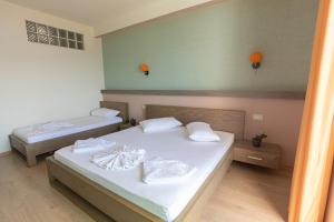 Postel nebo postele na pokoji v ubytování Hotel Picasso