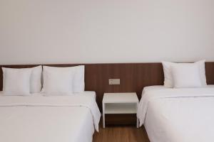 Postel nebo postele na pokoji v ubytování Hoang Loc Villa